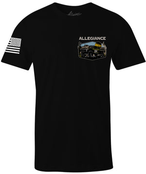 Front of Baja Classic Tee in black featuring small off-road racing truck chest graphic with American flag and Allegiance branding.