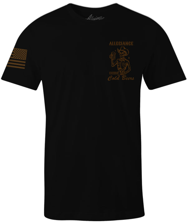 Front of Cold Beer Graphic Tee in black featuring small skeleton holding a beer graphic and American flag. sleeve print.
