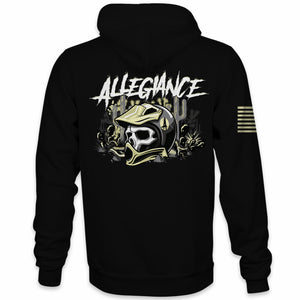 A black hoodie with a graphic design of a skull in a desert helmet on the back, surrounded by desert elements and the Allegiance logo.