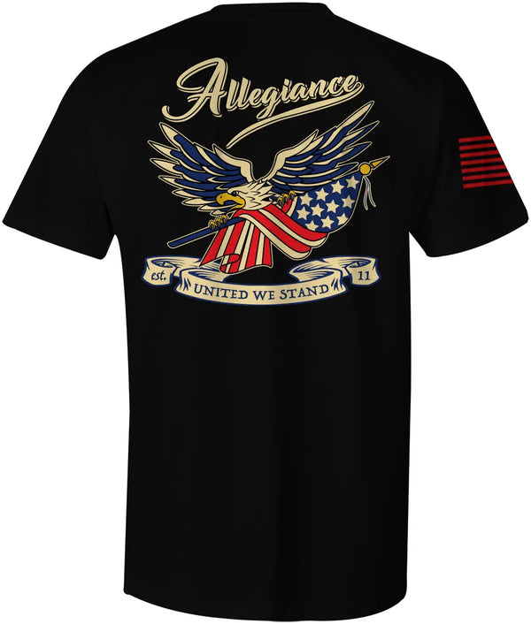 Back of Loyalty Tee in black showcasing large bald eagle graphic holding crossed American flags with Allegiance script and "United We Stand" banner.