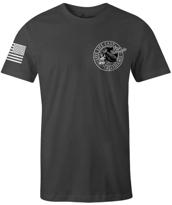 Front of Winged Premium Tee in dark charcoal with small skull and wing chest graphic and American flag on the sleeve.